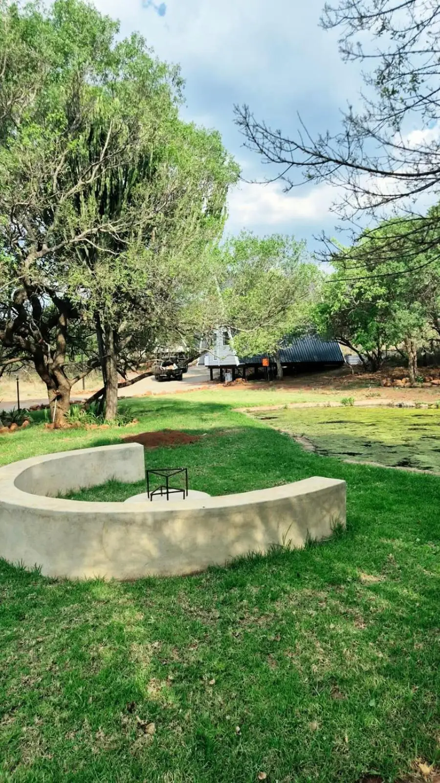The fire pit: a curved concrete bench on the lawn